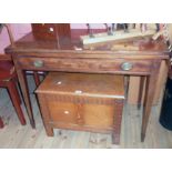 A 3' 2 1/4" 19th Century mahogany fold-over tea table with double gated action and long frieze