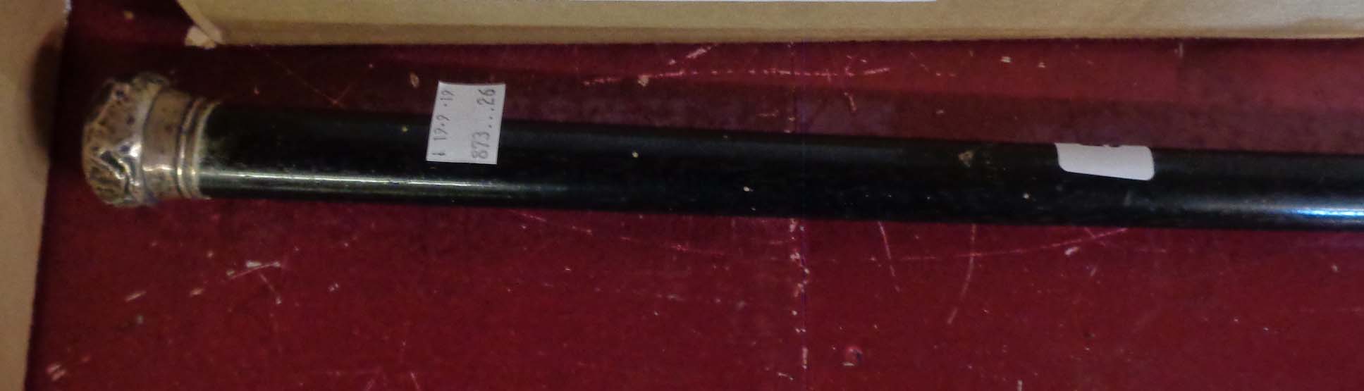 A silver topped ebony walking cane - dented and marks worn