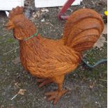 A cast iron garden chicken with rusted finish