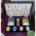 A cased set of Royal Copenhagen ornate coffee cups and saucers in various colours - various