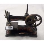An early 20th Century German toy sewing machine No. 205579, likely Casige