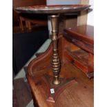 A decorative moulded plastic pedestal wine table