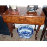 A 30" 20th Century figured walnut and cross banded drop leaf table with swivel top, set on