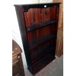 A 32" modern stained pine four shelf open bookcase