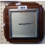 A 1930's polished oak framed aneroid wall barometer with faded square dial