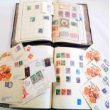 Two schoolboy albums containing a collection of world stamps
