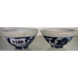 A pair of antique Chinese bowls with moulded Bagua symbols to rim - cracked and repaired