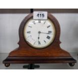 A late 19th Century mahogany cased table timepiece with eight day movement and brass ball feet