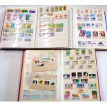 Three stock albums containing mainly 20th Century commemorative stamps from Africa, Asia Pacific and