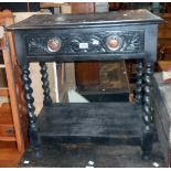 A 27" ebonised and carved wood side table with copper back plate handles, barley twist supports