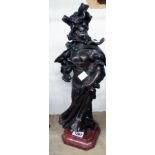 An Art Nouveau bronzed spelter figure on red marble base