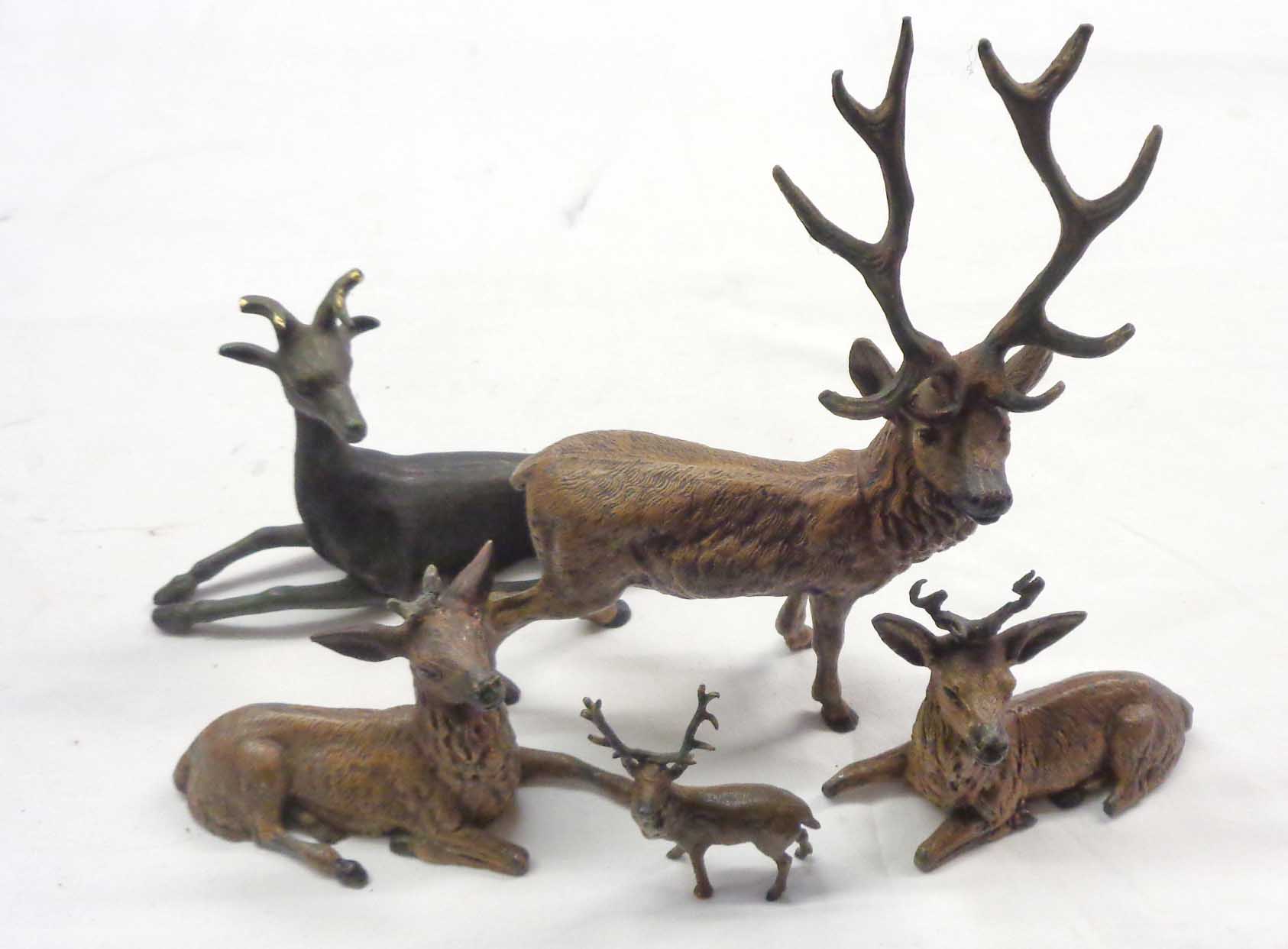 A collection of cast metal deer figures, mostly painted - various condition