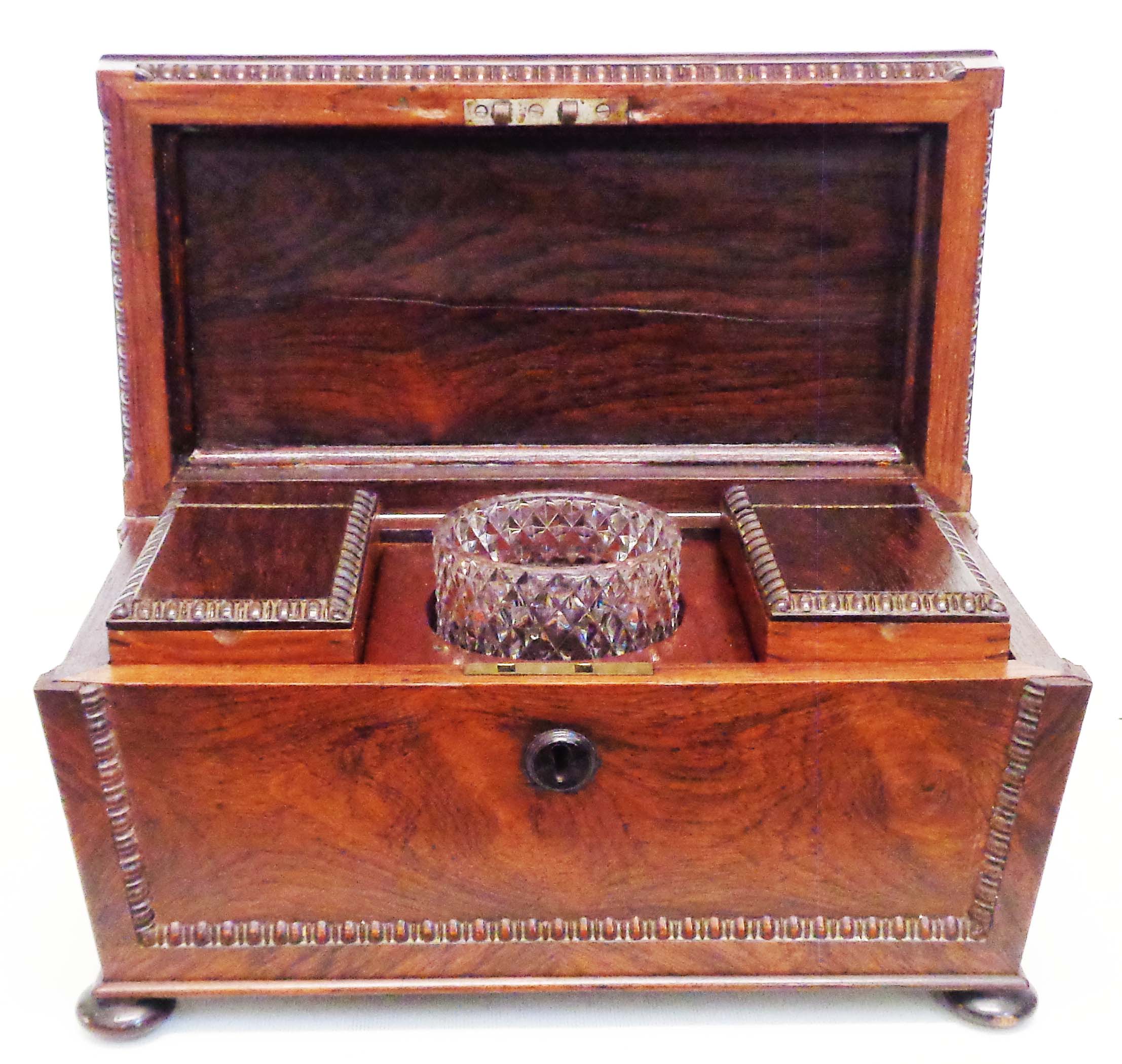 A 13" Victorian rosewood sarcophagus shaped twin compartment tea caddy with beaded borders, two