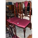 Three matching Edwardian stained wood framed high back dining chairs with harebell and rosette
