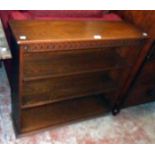 A 36" 20th Century polished oak and mixed wood three shelf open bookcase