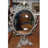 A brass framed table mirror