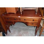 A 3' 6" Victorian mahogany knee-hole desk with four drawers, set on turned legs