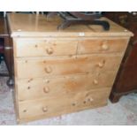 A 3' 5" 19th Century waxed pine chest of two short and three long graduated drawers - feet missing