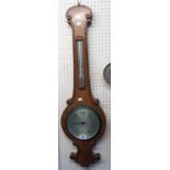 A 19th Century oak cased banjo barometer thermometer with mercury works and silvered dial marked for
