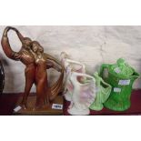 Three decorative female figures, a teapot and an Art Deco plaster figure group