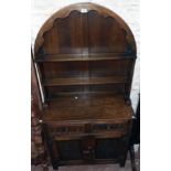 A 36" 20th Century polished oak two part dresser with domed top two shelf open plate rack over two