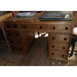 A 3' 11 1/2" Victorian waxed pine twin pedestal desk with later leather inset top, three frieze