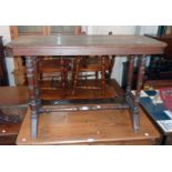 A 3' 6" Edwardian walnut side table, set on twin flanking turned supports with spindles and
