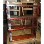 A 24" Victorian mahogany wall mounted four shelf open bookcase with decorative pierced standard ends