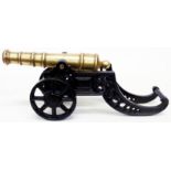 A cast brass and iron model cannon