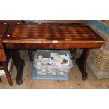 A 3' 6" Victorian rosewood and satin wood centre table with geometric and cross banded decoration to