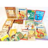 A selection of vintage and later children's books including Rupert, Beatrix Potter and A. A. Milne