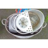 A galvanized mop bucket, bath and coal helmet