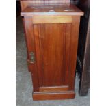 A 15" Edwardian walnut pot cupboard enclosed by a moulded panel door, set on plinth base