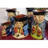 Five Torquay Pottery Toby jugs - various size