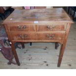 A 30" late Georgian mahogany and strung lowboy with two short and one long drawer, set on