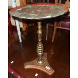 A decorative moulded plastic pedestal wine table