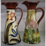 Two Torquay Pottery slender jugs with fluted rims and Persian style decoration