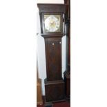 An antique oak longcase clock with later carved decoration, the 11" brass and silvered square dial