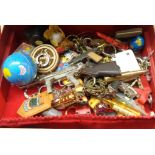 A box containing various novelty key rings