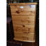 A 17 1/4" modern waxed pine bedside chest of four drawers