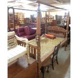 A 3' 6" early 20th Century late Raj period Indian hardwood four poster bed with silver coin set