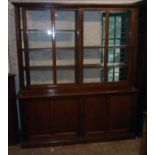 A 6' 3" early 20th Century mahogany two part book cabinet with two sets of adjustable shelves