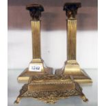 A pair of brass corinthian column candlesticks - sold with a cast brass flip-top stamp box