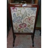 A Victorian walnut Chinese Chippendale style rise and fall fire screen with embroidered panel, set