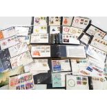 Two ring bound covers albums containing IOM FDC's - sold with other loose FDC's and some stamps