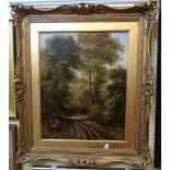 Adam Barland: an ornate gilt framed oil on canvas, depicting travellers on a woodland track -