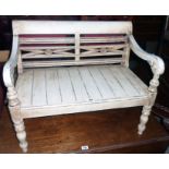A 29" decorative painted wood and antiqued child's bench with pierced and moulded back, open