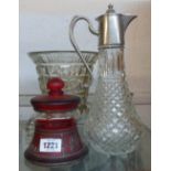 A claret jug, red glass pot and pressed vase