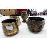 A Siamese silvered brass bowl with high relief figures, two Egyptian brass pots and a small Indian