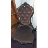 A Victorian walnut show frame spoon back parlour chair with carved and pierced decoration, button-